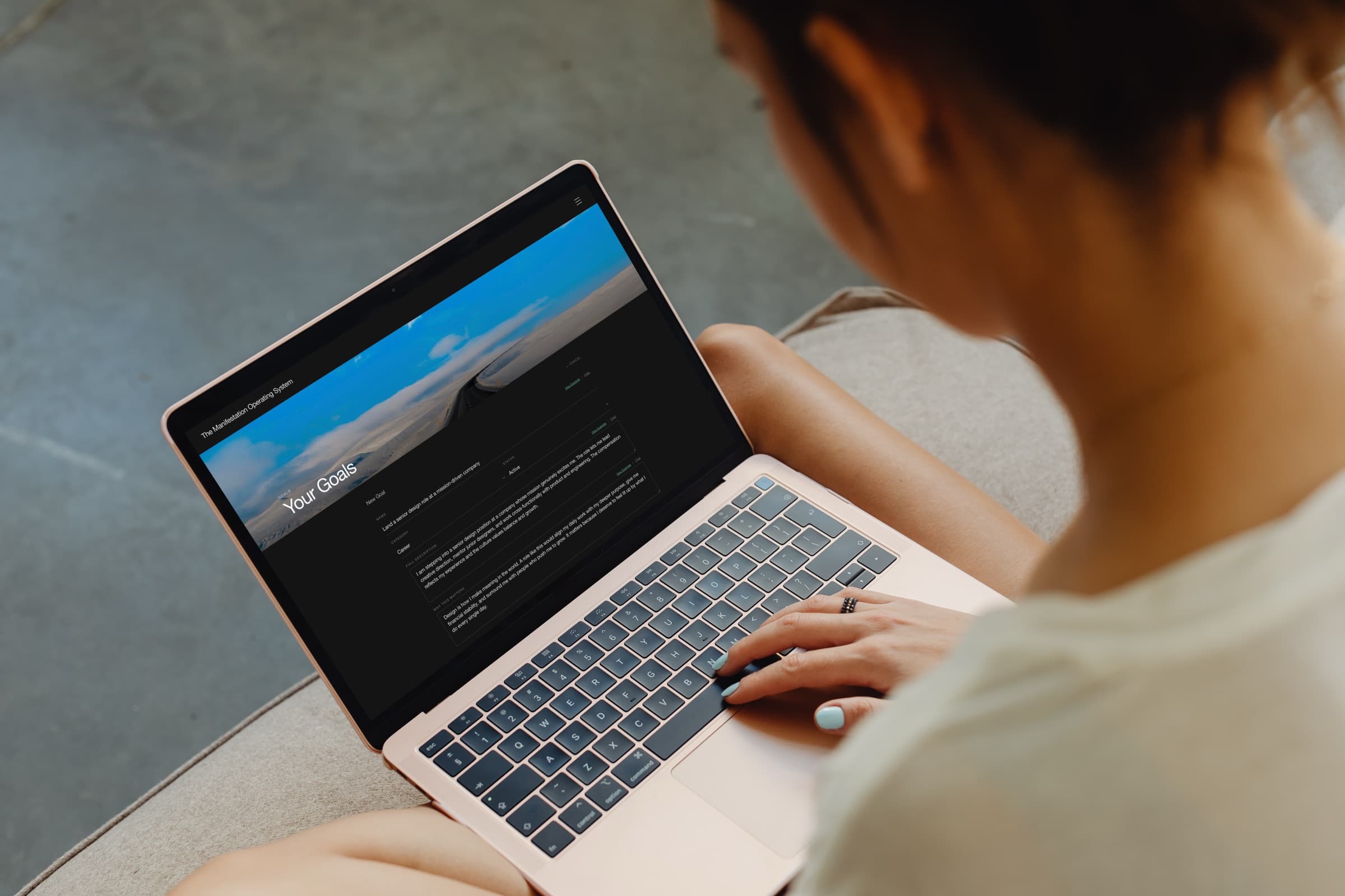 Person using a laptop to review goals and progress